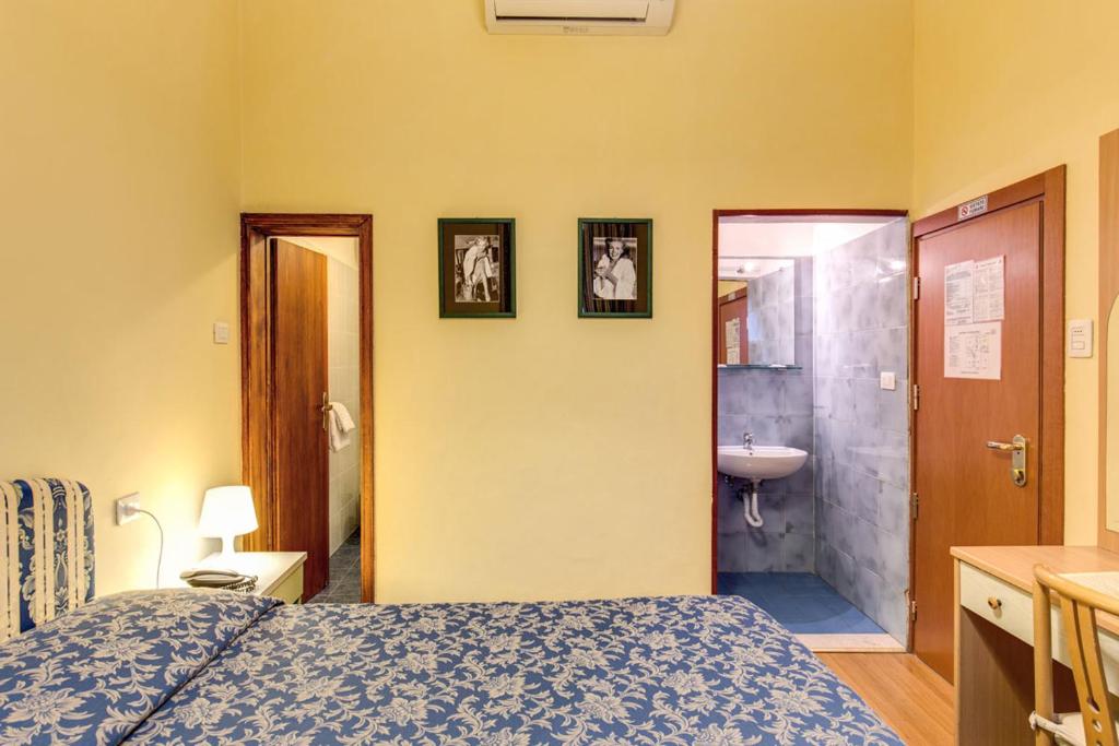 Postel nebo postele na pokoji v ubytování Hotel Romagna
