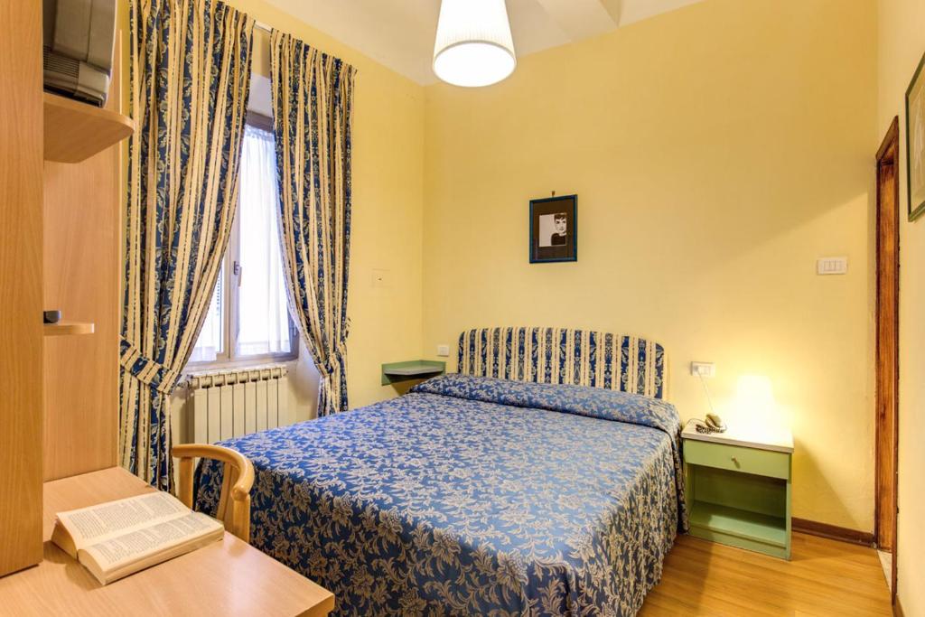 Postel nebo postele na pokoji v ubytování Hotel Romagna