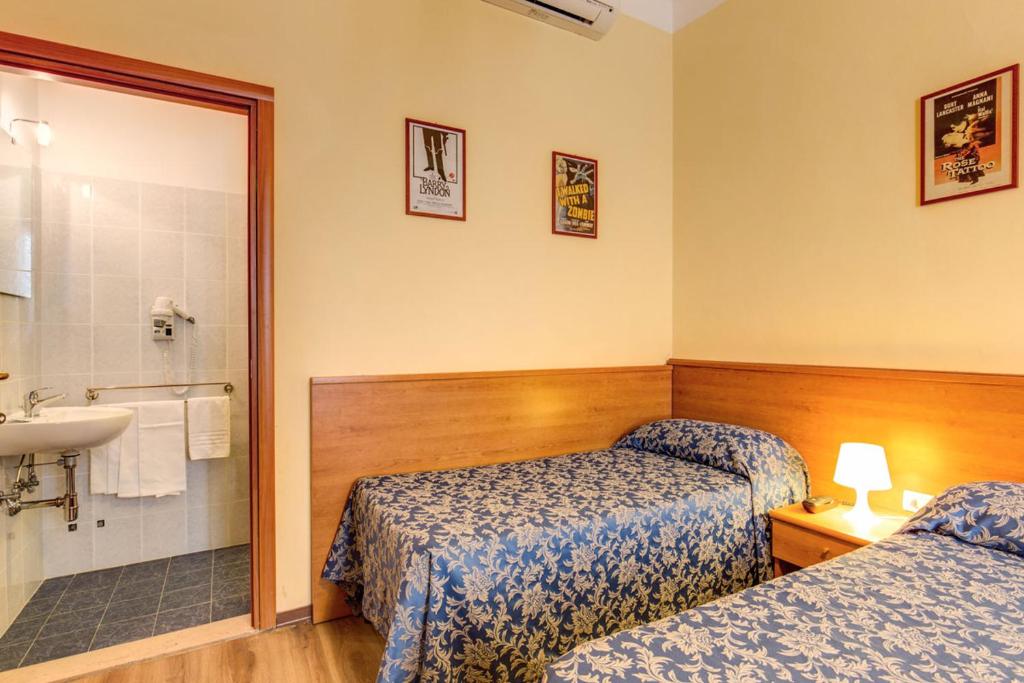 Postel nebo postele na pokoji v ubytování Hotel Romagna