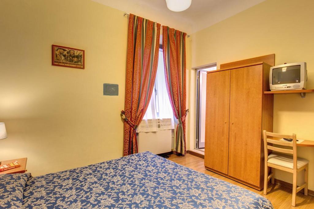 Postel nebo postele na pokoji v ubytování Hotel Romagna