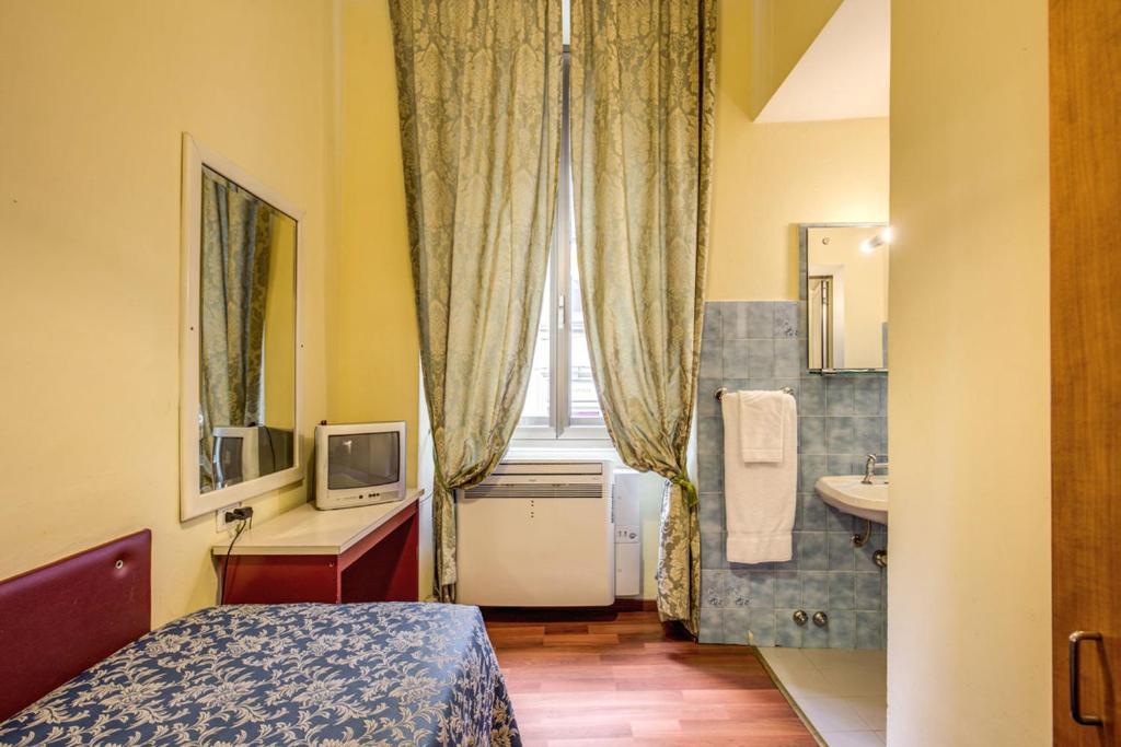 Postel nebo postele na pokoji v ubytování Hotel Romagna
