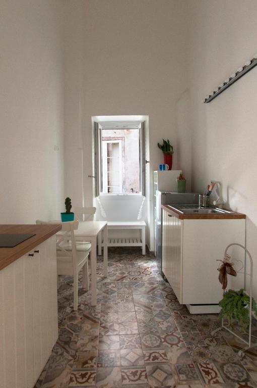 Postel nebo postele na pokoji v ubytování La Serva Padrona