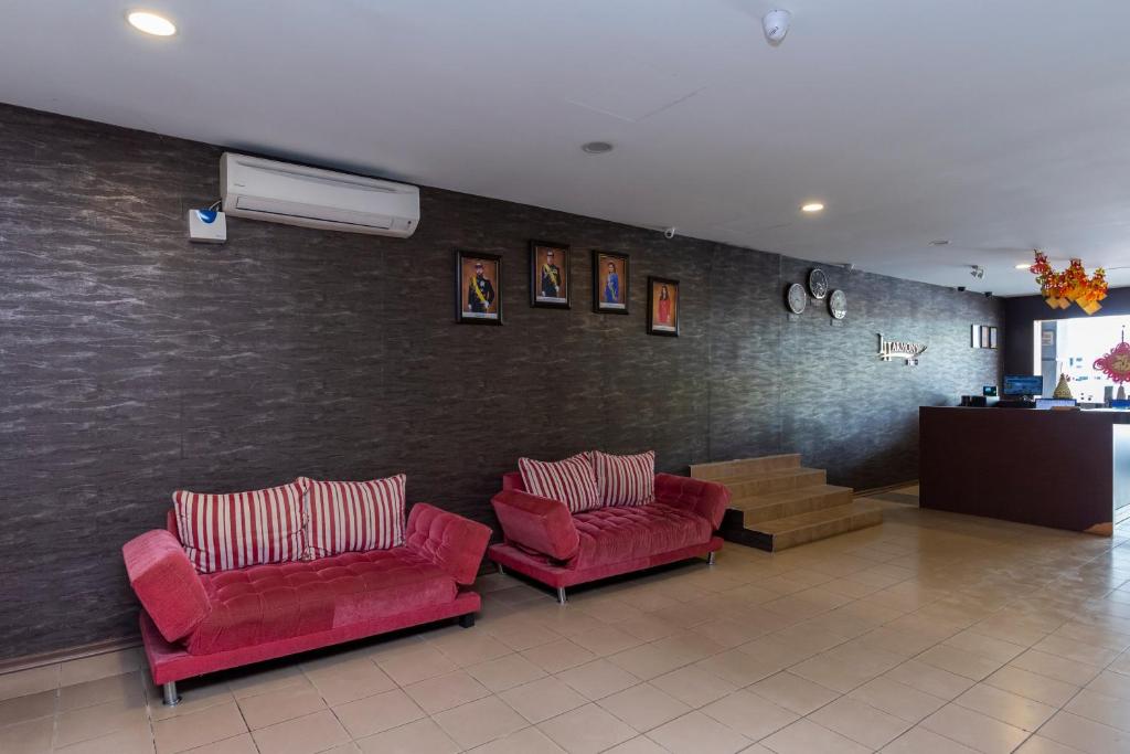 Posezení v ubytování I Harmony Hotel