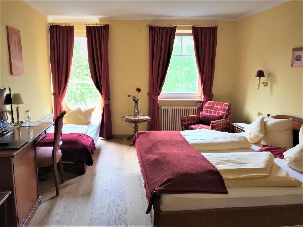 Postel nebo postele na pokoji v ubytování Hotel Garni Wiestor