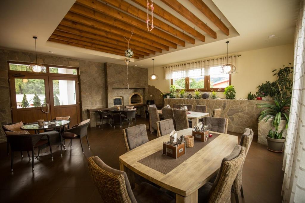 a dining room with a table and chairs at Penzión Stavbet in Svidník