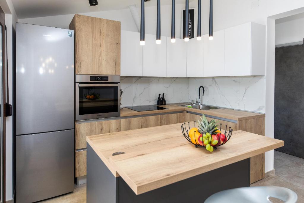 Kuchyň nebo kuchyňský kout v ubytování Apartman Gulin