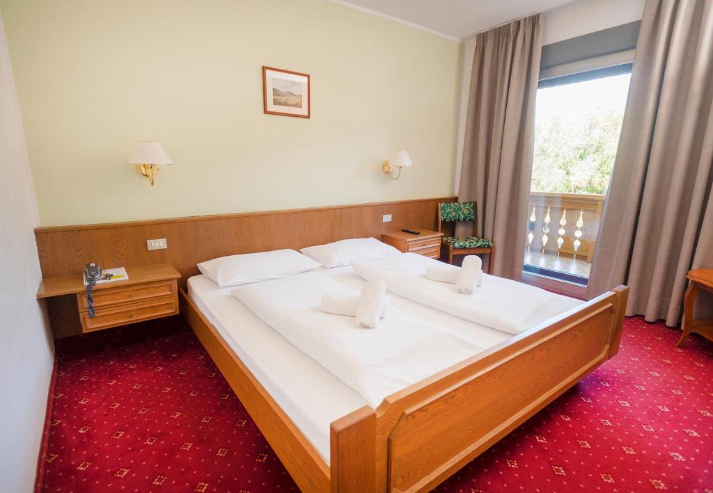 Posteľ alebo postele v izbe v ubytovaní Hotel Marlingerhof