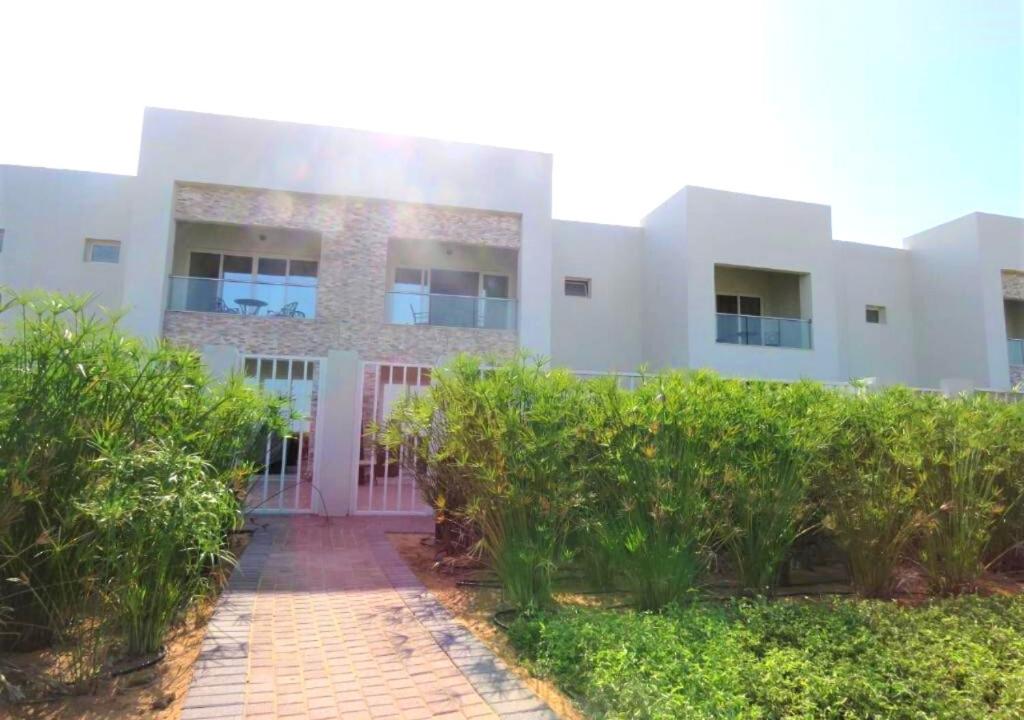 a large building with a view of a city at Holiday Home 3 bedroom Seaview in Ras al Khaimah