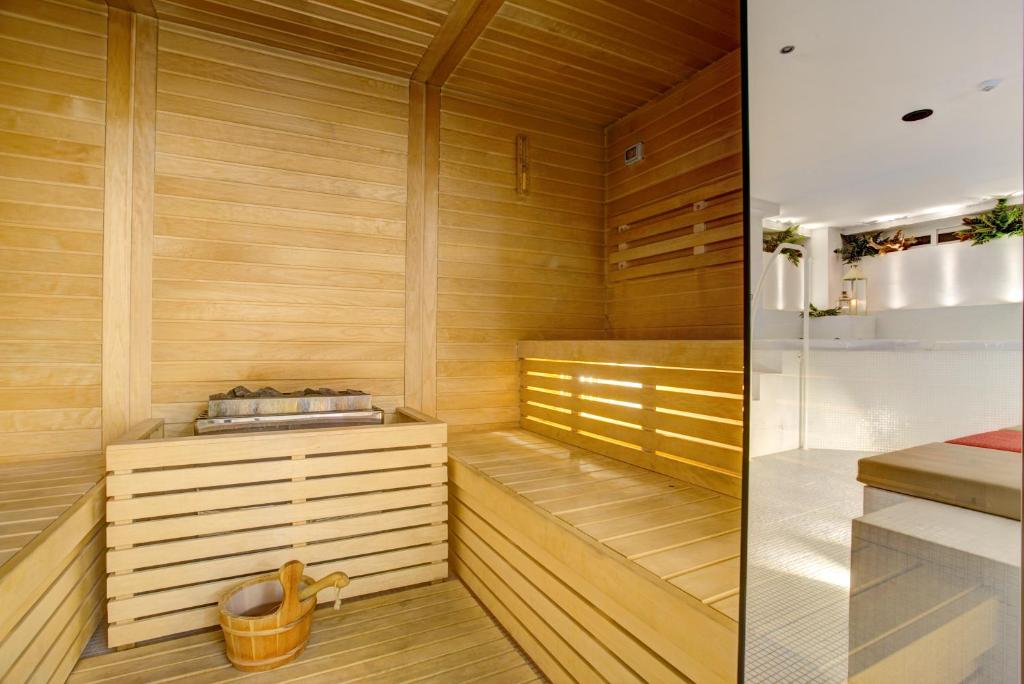 a sauna with wooden walls and wooden flooring at Hotel Lalla Beauty & Relax in Cesenatico
