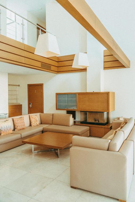 a living room with a couch and a table at Arfa Park-Hotel in Adler