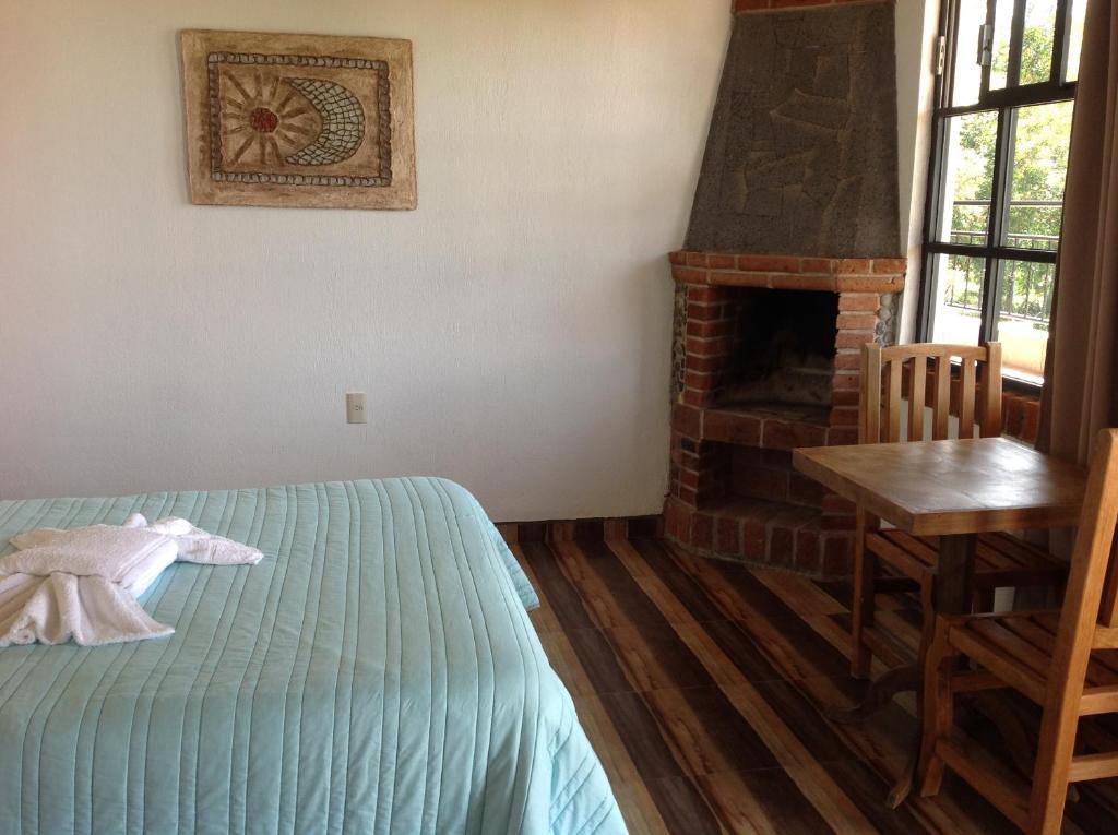 Postel nebo postele na pokoji v ubytování Hotel Finca Las Bovedas
