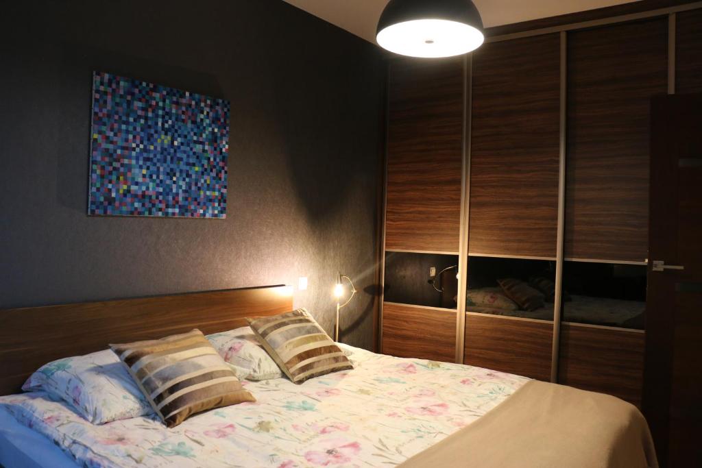Łóżko lub łóżka w pokoju w obiekcie Center - Atelier Residence