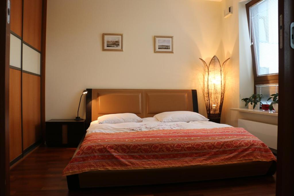 Łóżko lub łóżka w pokoju w obiekcie Center - Atelier Residence