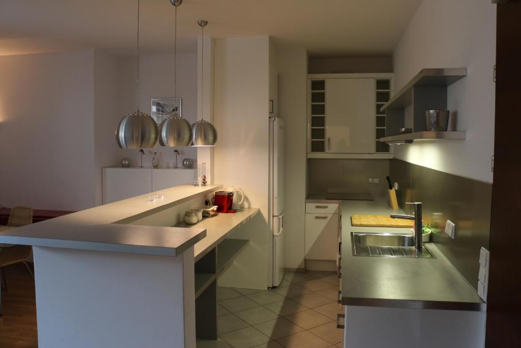 Kuchnia lub aneks kuchenny w obiekcie Center - Atelier Residence