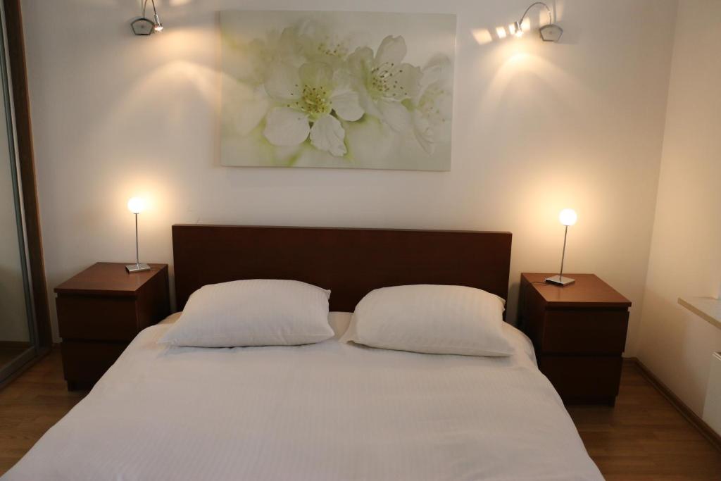 Łóżko lub łóżka w pokoju w obiekcie Center - Atelier Residence