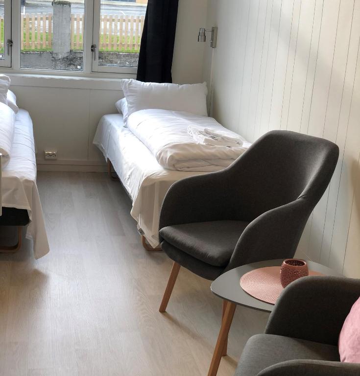 Postel nebo postele na pokoji v ubytování Ami Hotel