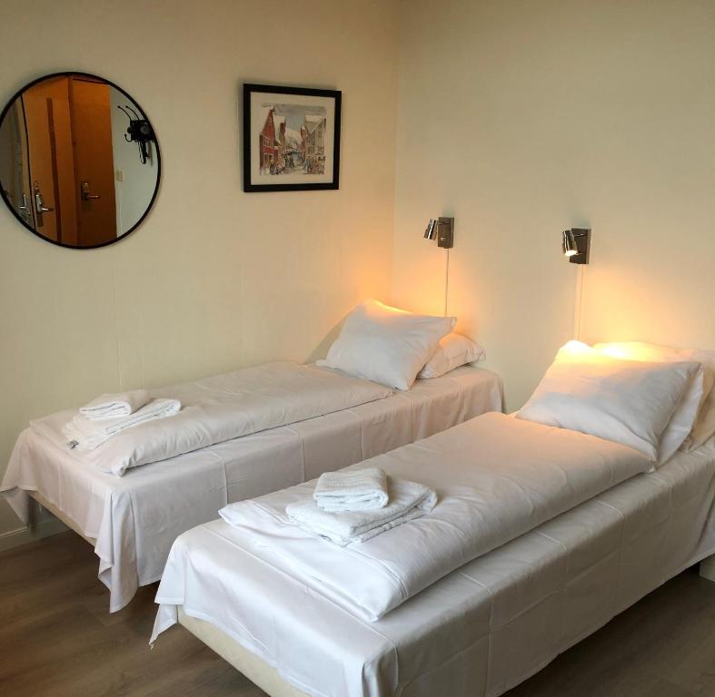 Postel nebo postele na pokoji v ubytování Ami Hotel