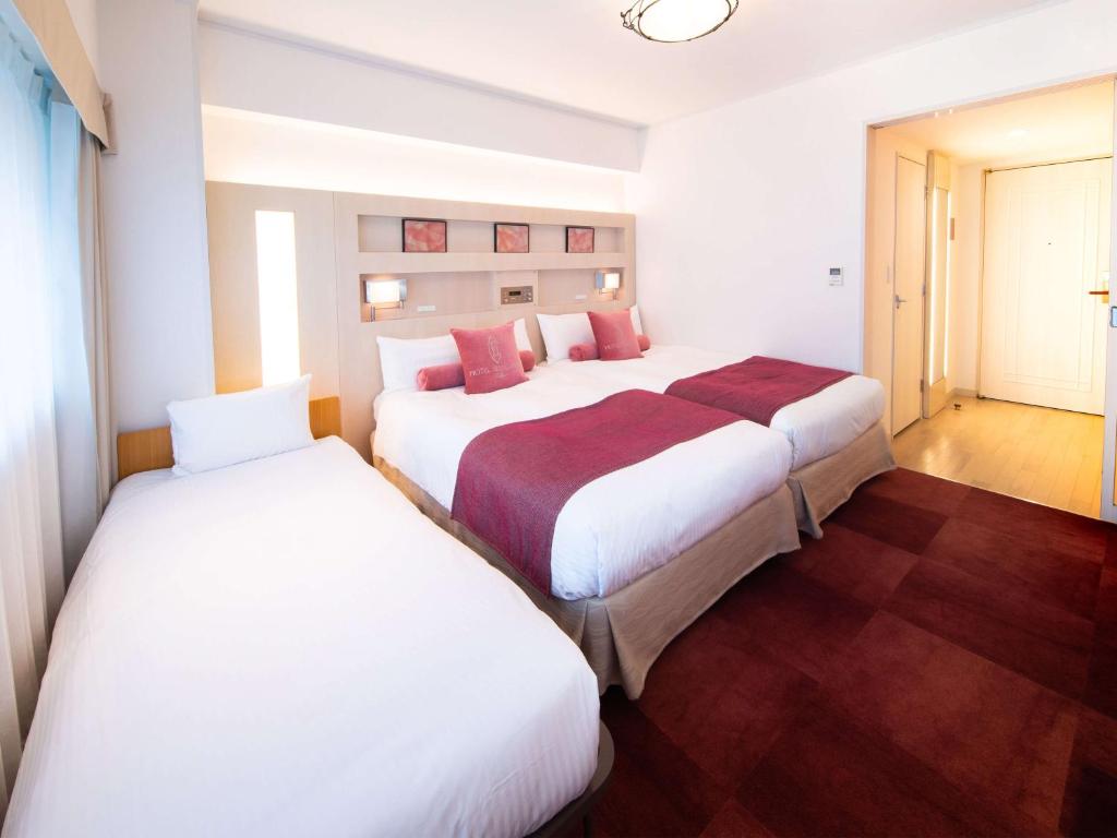 Postel nebo postele na pokoji v ubytování Hotel Bellclassic Tokyo