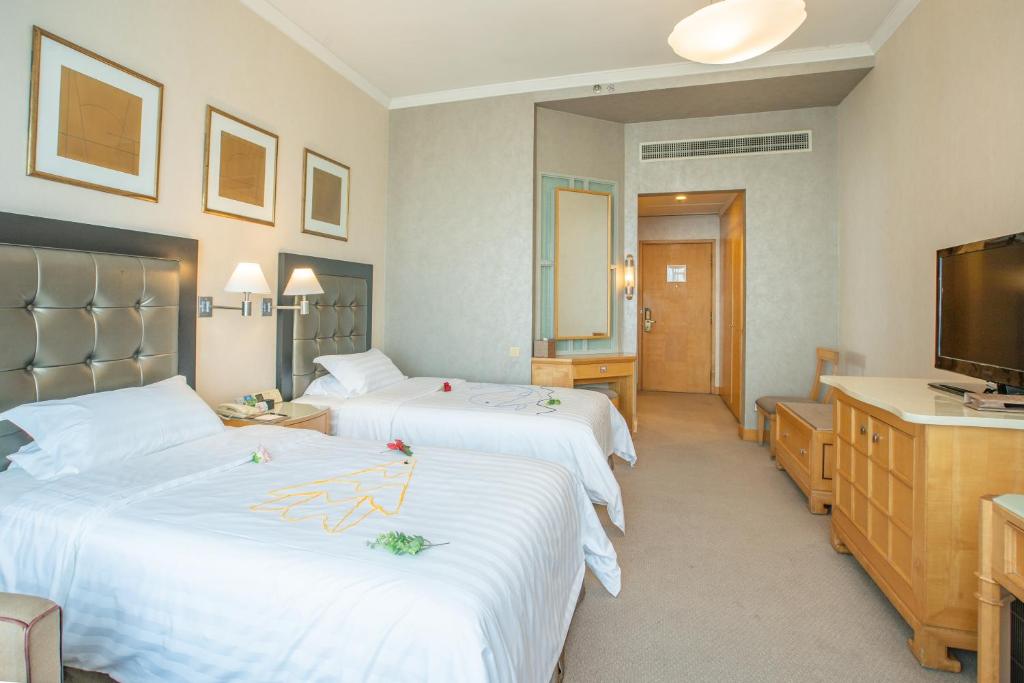 TV a/nebo společenská místnost v ubytování Shantou Junhua Haiyi Hotel