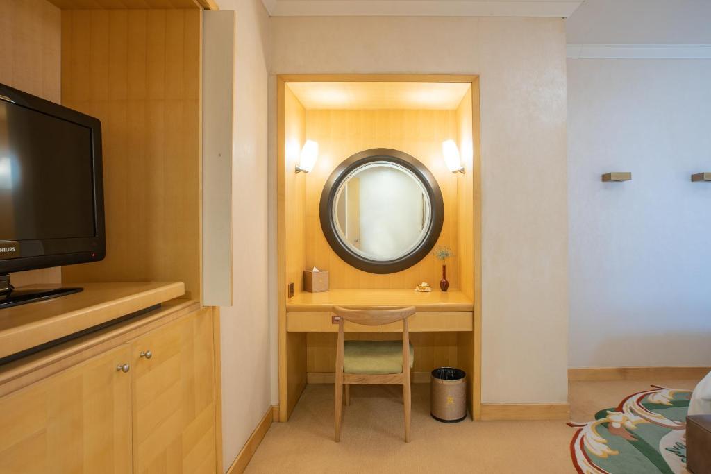 TV a/nebo společenská místnost v ubytování Shantou Junhua Haiyi Hotel