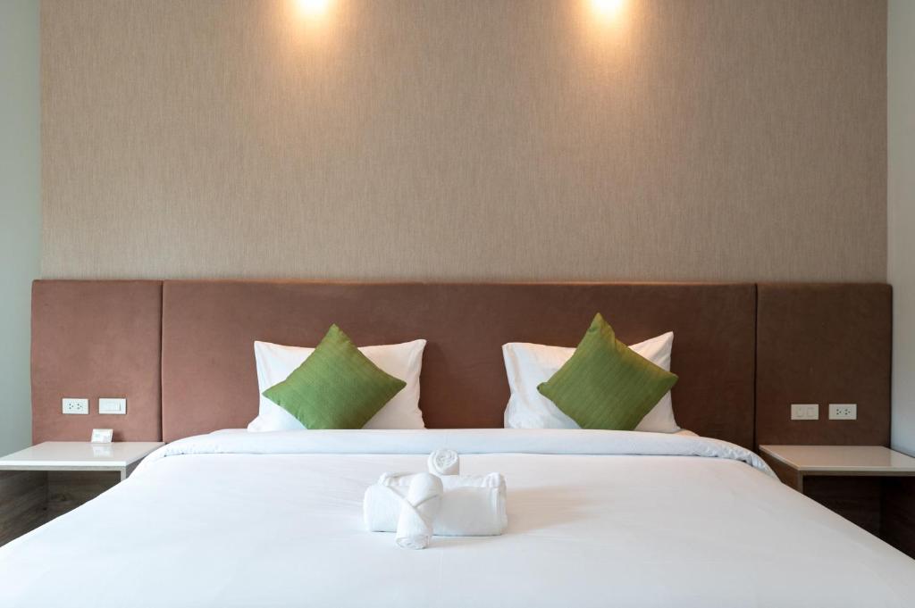 Postel nebo postele na pokoji v ubytování Phumontra Resort Nakhon Nayok