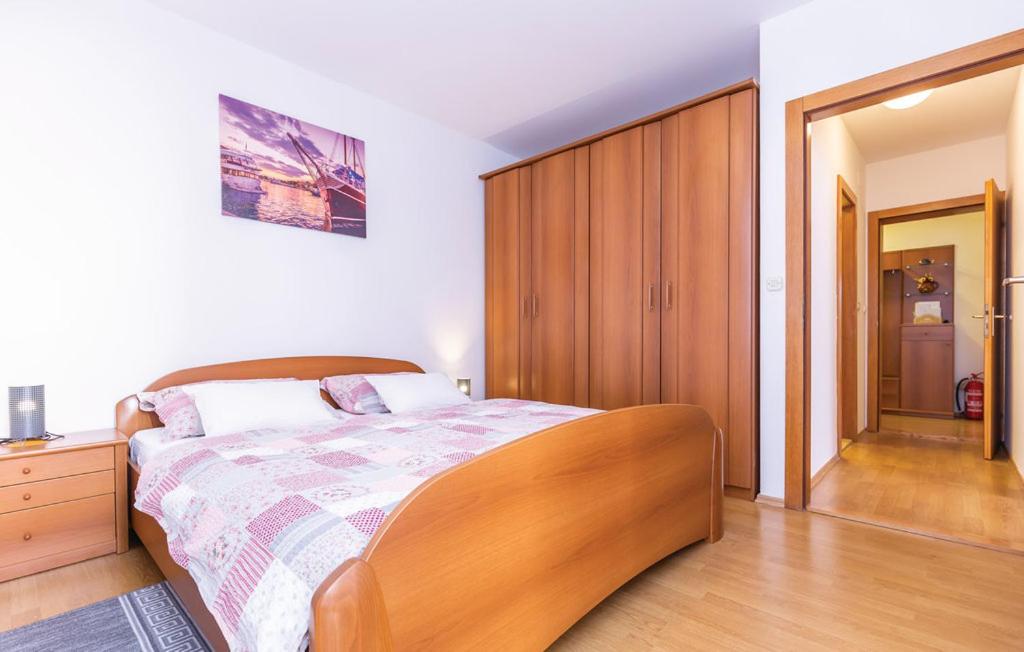 Postel nebo postele na pokoji v ubytování Apartman Mikulić Makarska