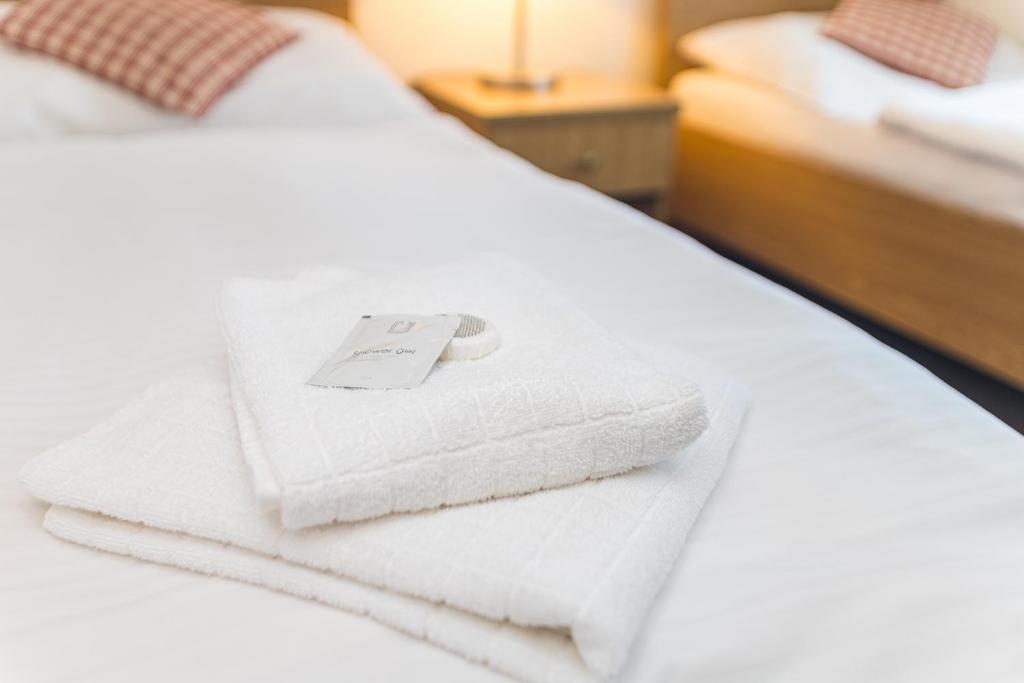 Łóżko lub łóżka w pokoju w obiekcie Hotel Seifert