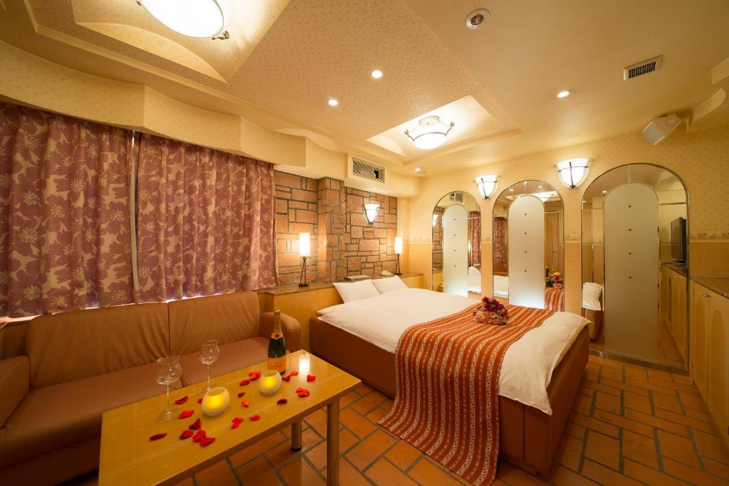 Postel nebo postele na pokoji v ubytování HOTEL THE i Adult only