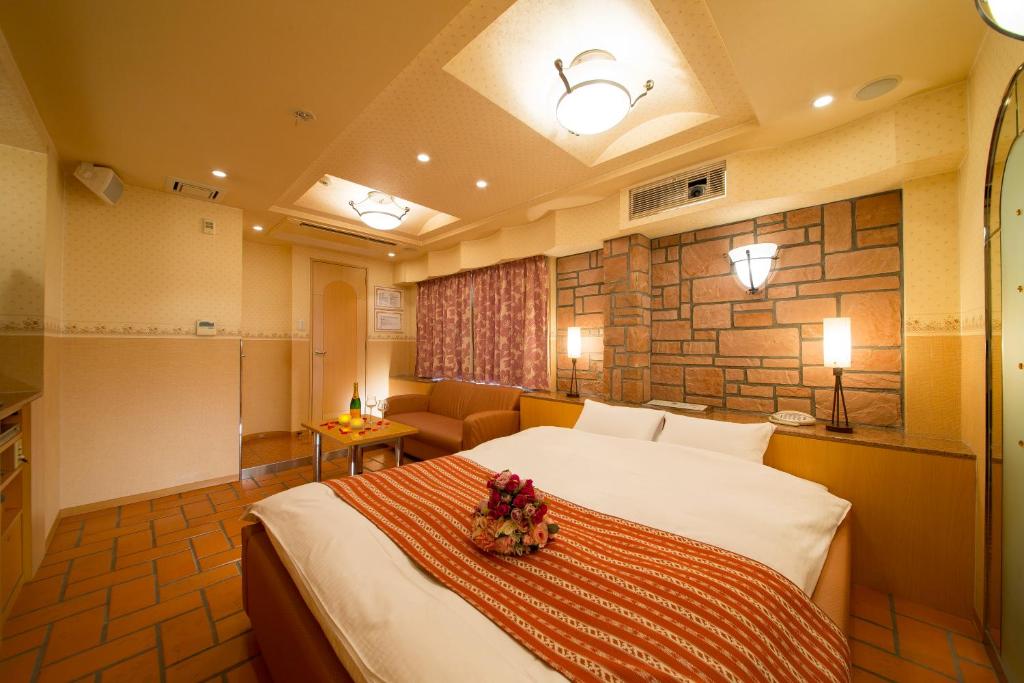 Postel nebo postele na pokoji v ubytování HOTEL THE i Adult only