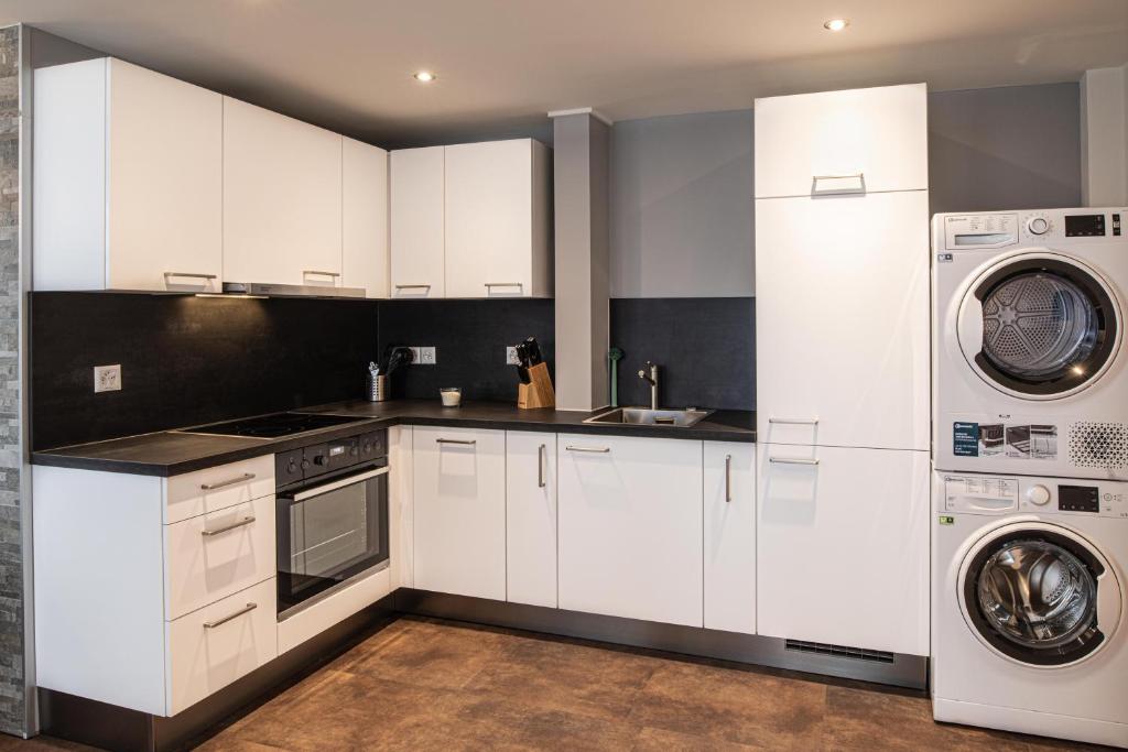 Kuchyň nebo kuchyňský kout v ubytování Apart Hotel Amadeo