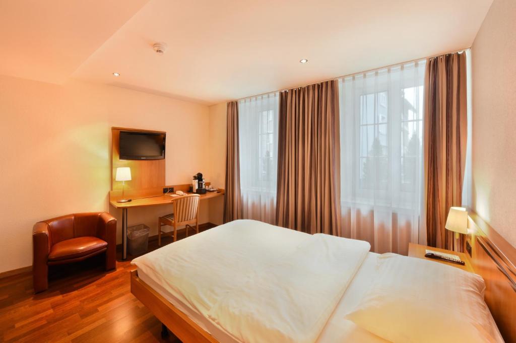 Postel nebo postele na pokoji v ubytování Apart Hotel Amadeo