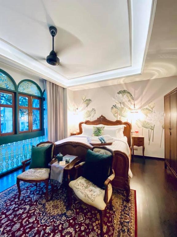 Postel nebo postele na pokoji v ubytování The Knight House Bangkok