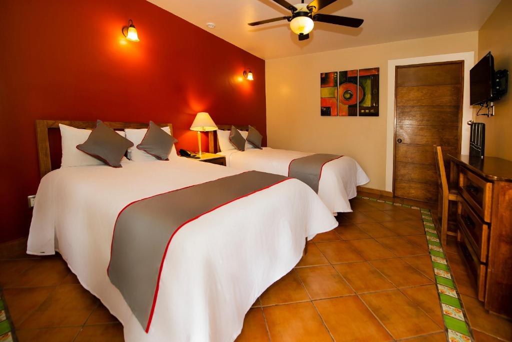 Postel nebo postele na pokoji v ubytování La Casona Tequisquiapan Hotel & Spa
