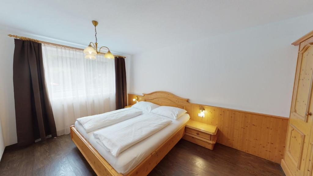 Posteľ alebo postele v izbe v ubytovaní Appartement Kitzsteinhorn -Summercard included