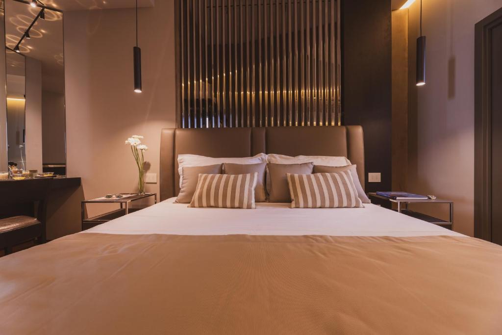 Postel nebo postele na pokoji v ubytování Callistos Hotel & Spa