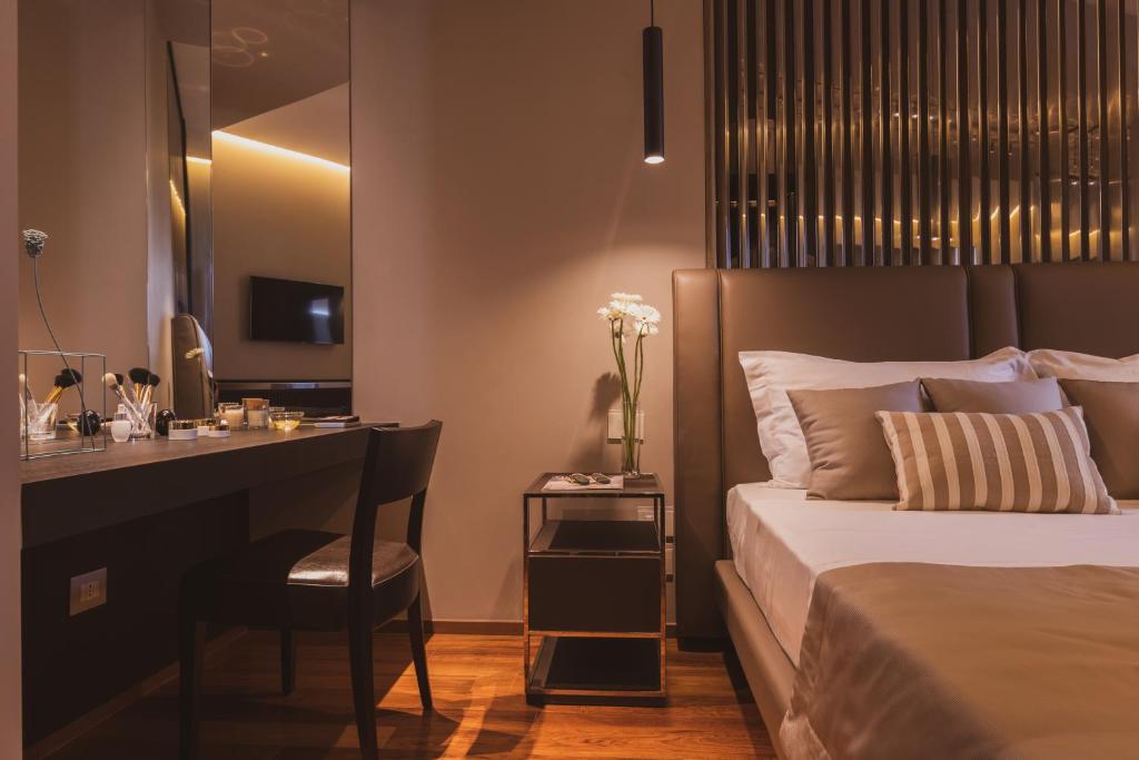 Postel nebo postele na pokoji v ubytování Callistos Hotel & Spa