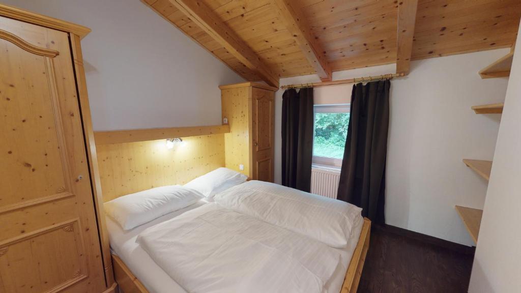 Posteľ alebo postele v izbe v ubytovaní Appartement Kitzsteinhorn -Summercard included