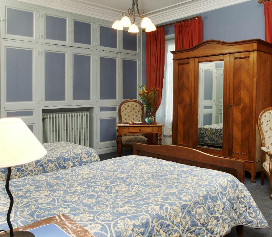 Postel nebo postele na pokoji v ubytování Hôtel Colombet