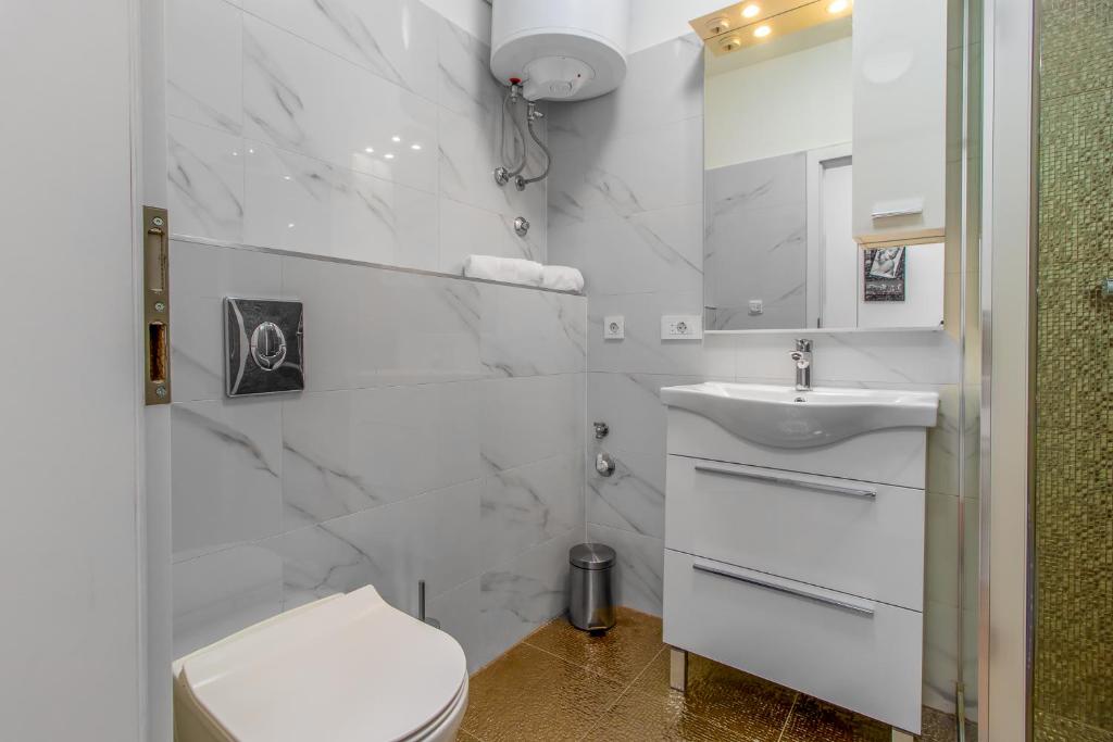 Kúpeľňa v ubytovaní Apartmani Dada