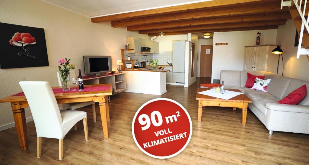 a living room with a sign that says anniversary at Appartementhotel Breitmattstub in Bühlertal