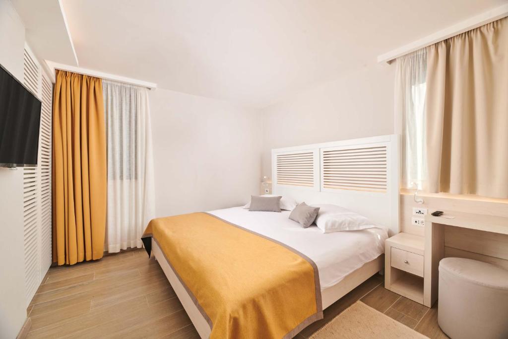 Ein Bett oder Betten in einem Zimmer der Unterkunft Villas Bellevue Plava Laguna
