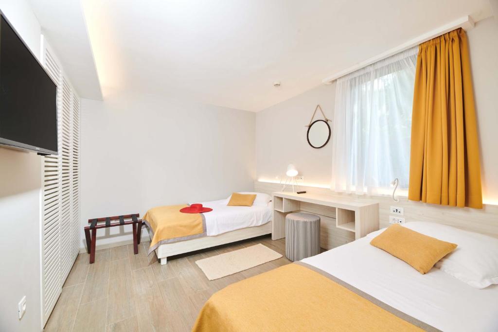 Ein Bett oder Betten in einem Zimmer der Unterkunft Villas Bellevue Plava Laguna