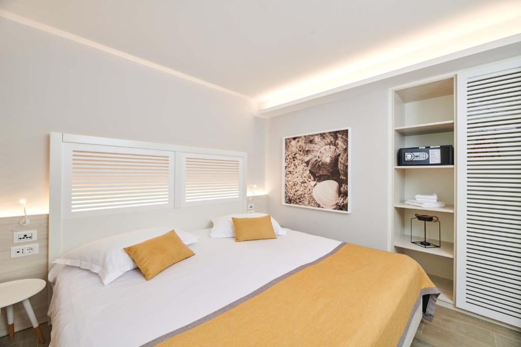 Ein Bett oder Betten in einem Zimmer der Unterkunft Villas Bellevue Plava Laguna