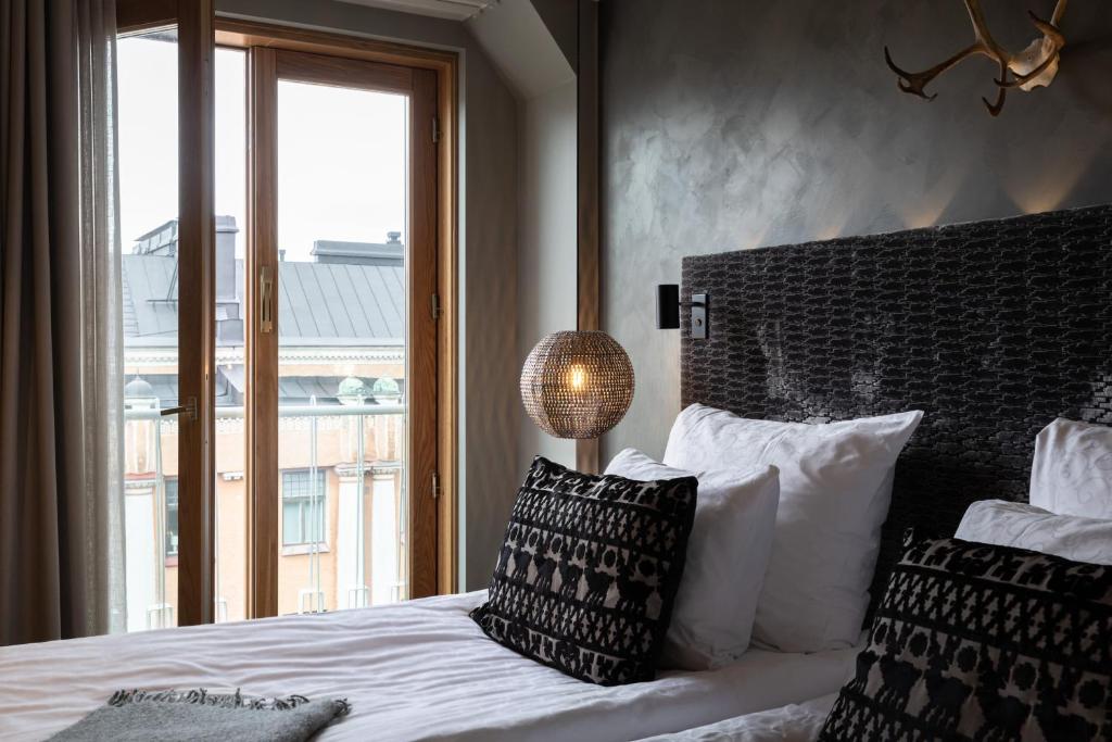 Postel nebo postele na pokoji v ubytování Lapland Hotels Bulevardi