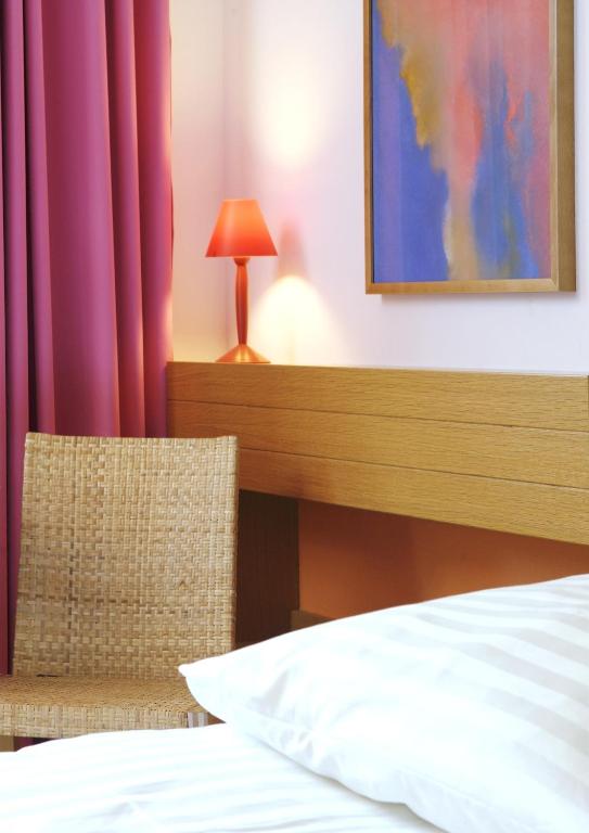Postel nebo postele na pokoji v ubytování 1st Creatif Hotel Elephant