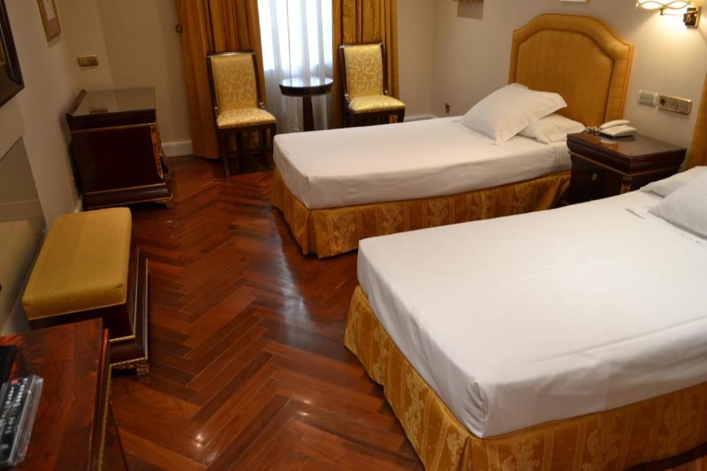 Postel nebo postele na pokoji v ubytování Hotel Alameda Palace