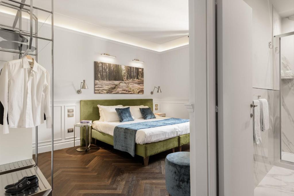 Postel nebo postele na pokoji v ubytování Albergo Chiusarelli