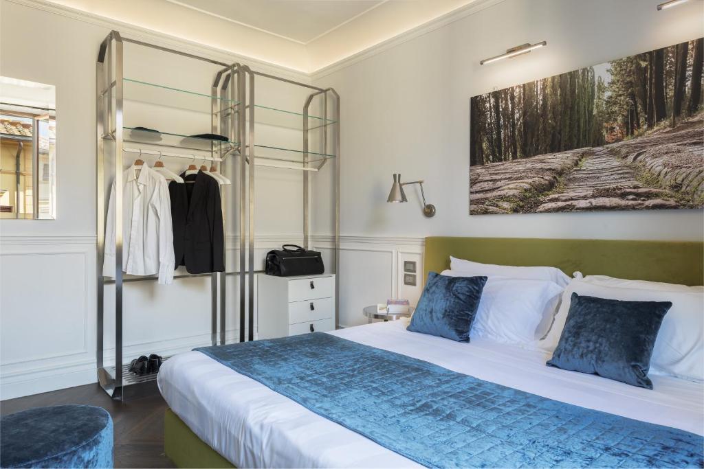 Postel nebo postele na pokoji v ubytování Albergo Chiusarelli