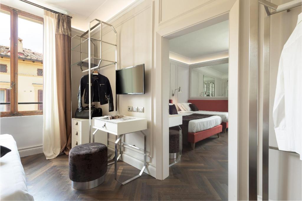 Postel nebo postele na pokoji v ubytování Albergo Chiusarelli