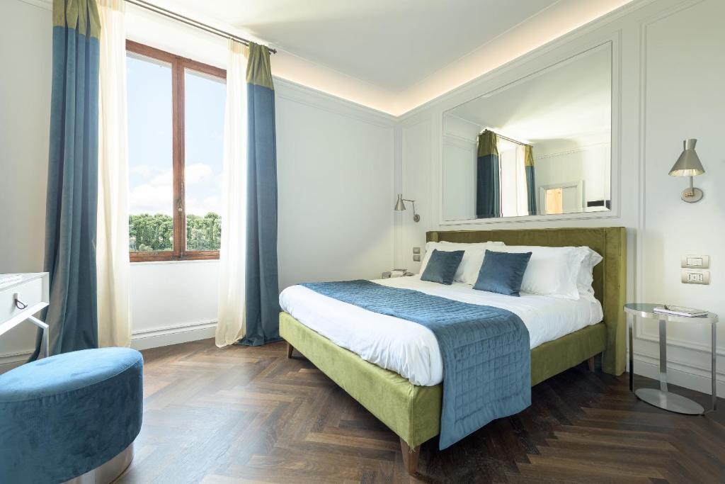 Postel nebo postele na pokoji v ubytování Albergo Chiusarelli